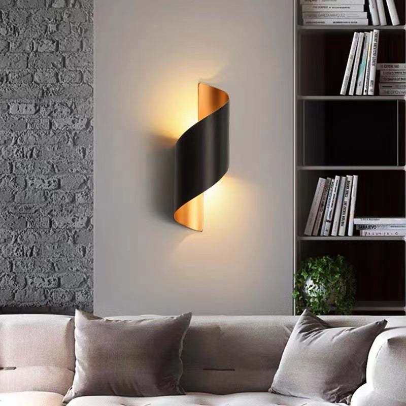 Modern spiral LED wall sconce, a decorative home lighting element for contemporary interiors.