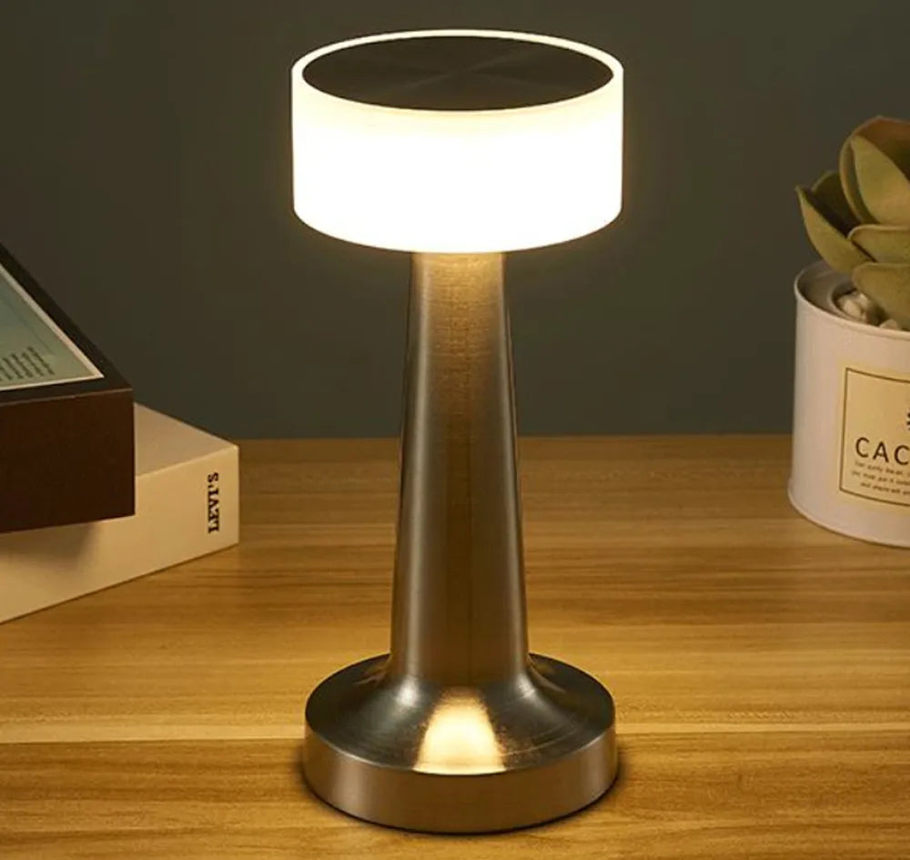 Rechargeable wireless LED table lamp with USB. Dimmable and portable for modern home decor accent lighting.