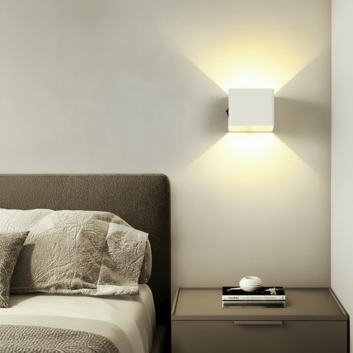 Wireless LED wall light with adjustable beam, USB rechargeable for easy installation & versatile accent lighting.