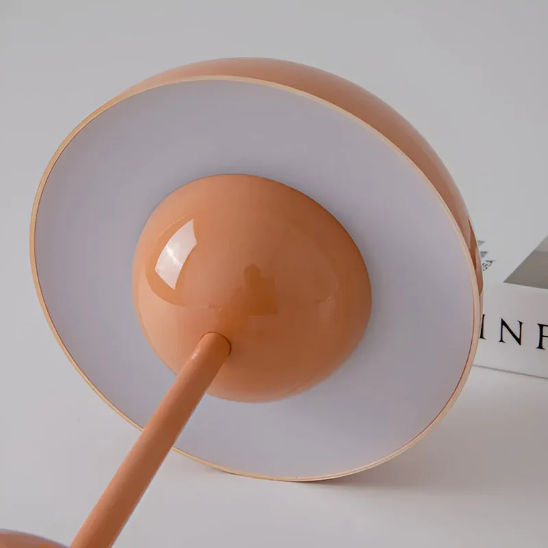 Stylish Scandinavian home decor: a modern wireless table lamp with soft, inviting ambiance light.
