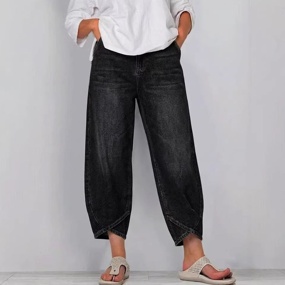 Chic women's barrel leg jeans, cropped length, offering a modern relaxed fit. Ideal for versatile casual wear.