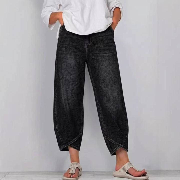Chic women's barrel leg jeans, cropped length, offering a modern relaxed fit. Ideal for versatile casual wear.