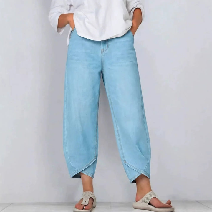 Fashionable women's cropped barrel leg jeans. Mid-rise, modern fit denim for a stylish and comfortable casual look.
