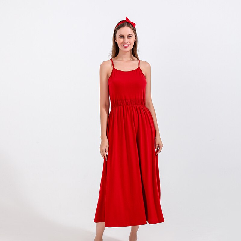 Close-up of a baby girl in a strapless red cotton dress, showcasing kid fashion and comfort.