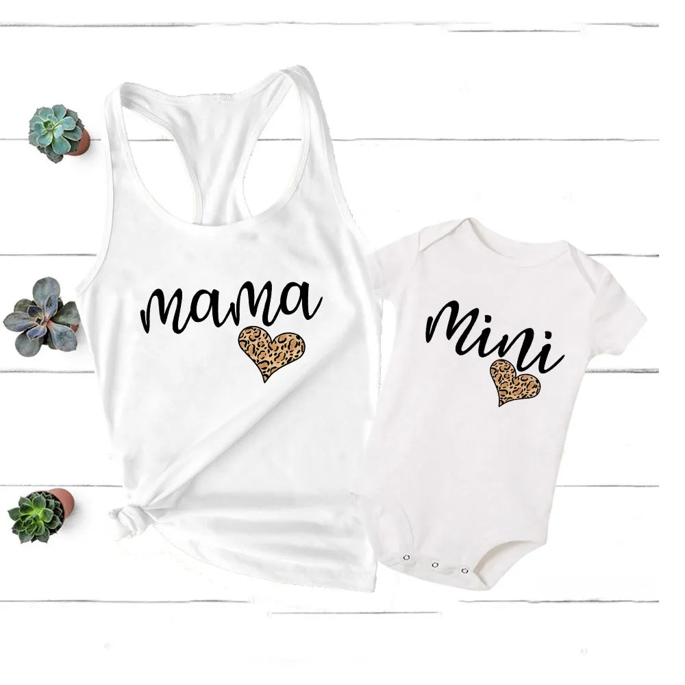 Stylish mother and baby in coordinating rainbow apparel, a perfect summer wardrobe update.