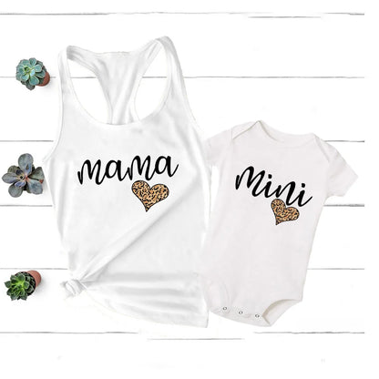 Stylish mother and baby in coordinating rainbow apparel, a perfect summer wardrobe update.