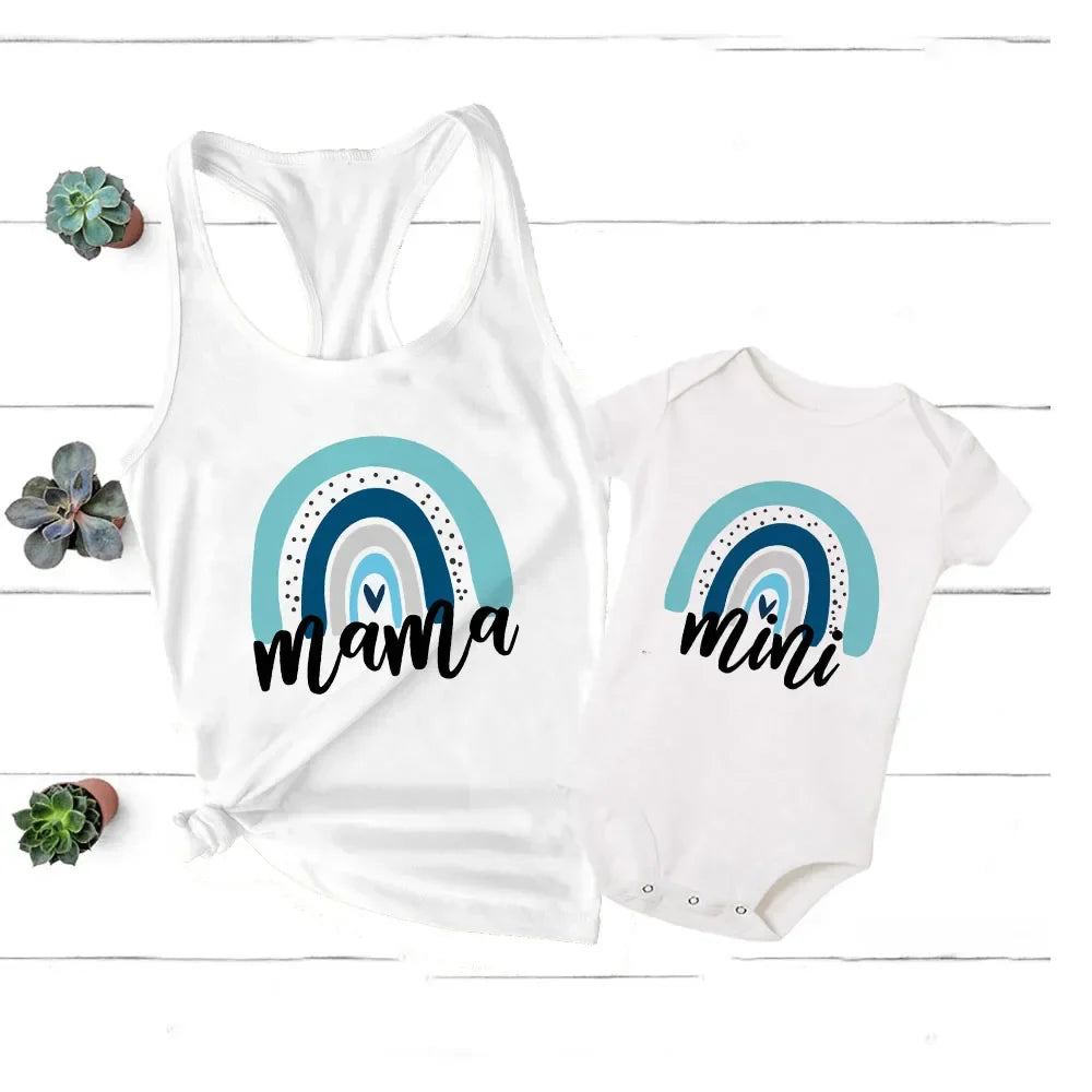 Family matching rainbow t-shirts for mom and baby, soft polyester blend, vibrant colors.