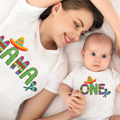 White 'ONE' themed infant romper for baby's first birthday, part of mom and baby matching set