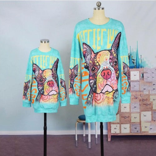 Stylish women's and kid's long-sleeve dog print dresses for a fun mommy and me casual look.