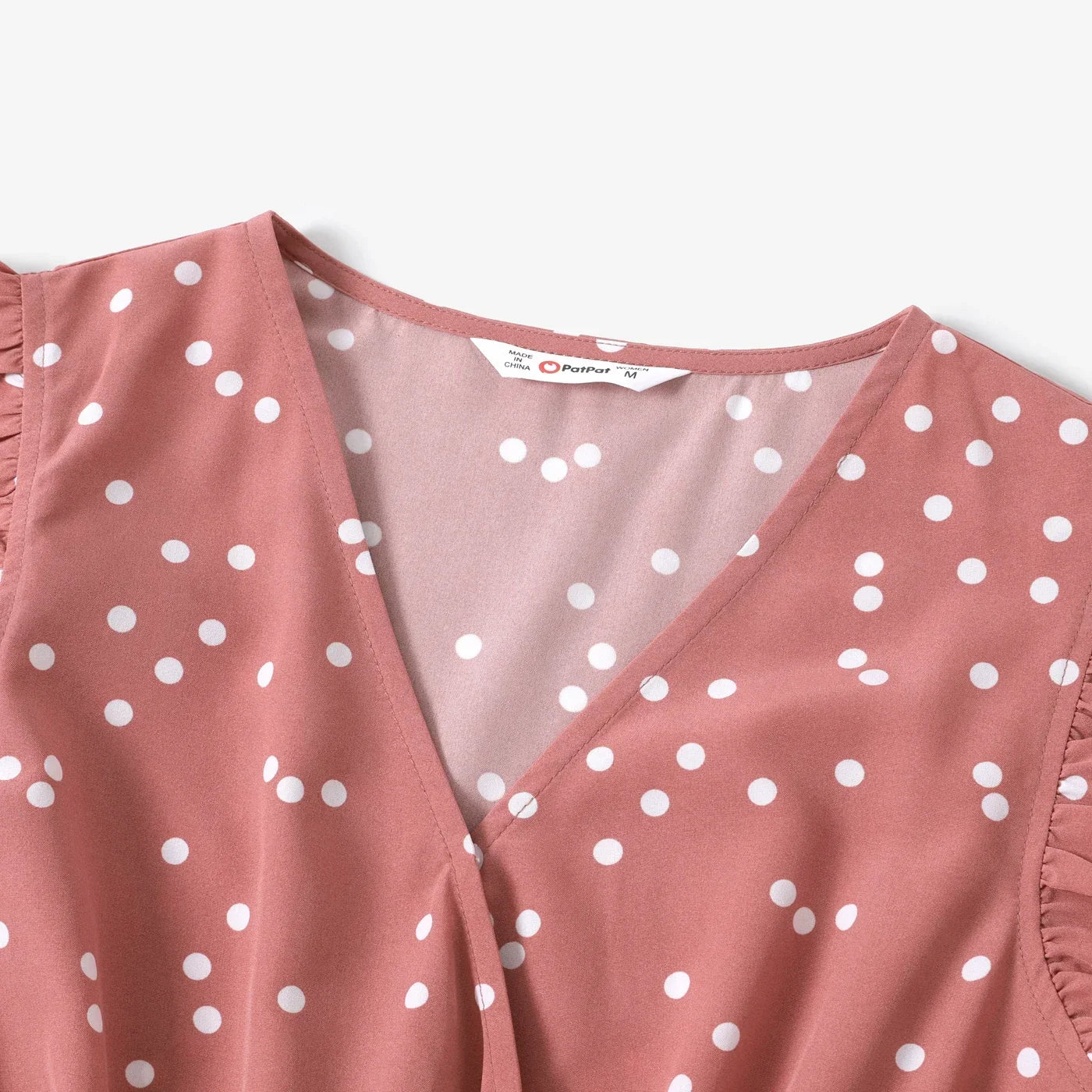 Girls' pink dotted dress with a comfortable elastic waistband and flared skirt