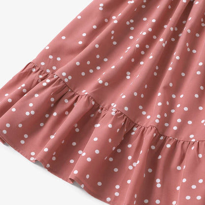 Family matching outfit: pink polka dot cross wrap dresses for a memorable photo opportunity