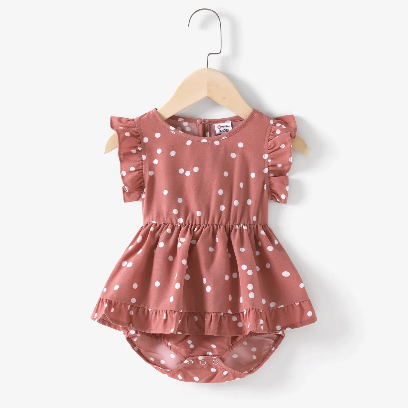 Girls' pink polka dot cross wrap dress with a playful and comfortable fit for summer
