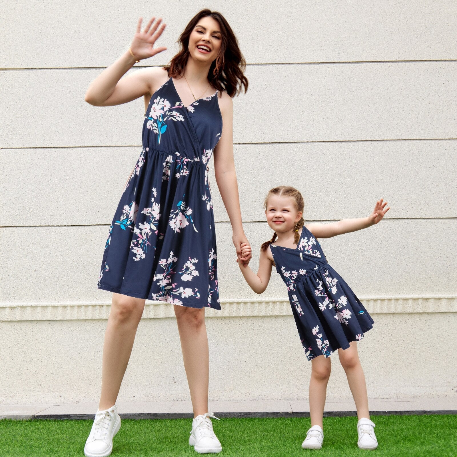 Mom and daughter in sunflower off-shoulder matching summer dresses, perfect for family outfits.