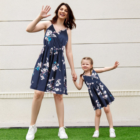Mom and daughter in sunflower off-shoulder matching summer dresses, perfect for family outfits.