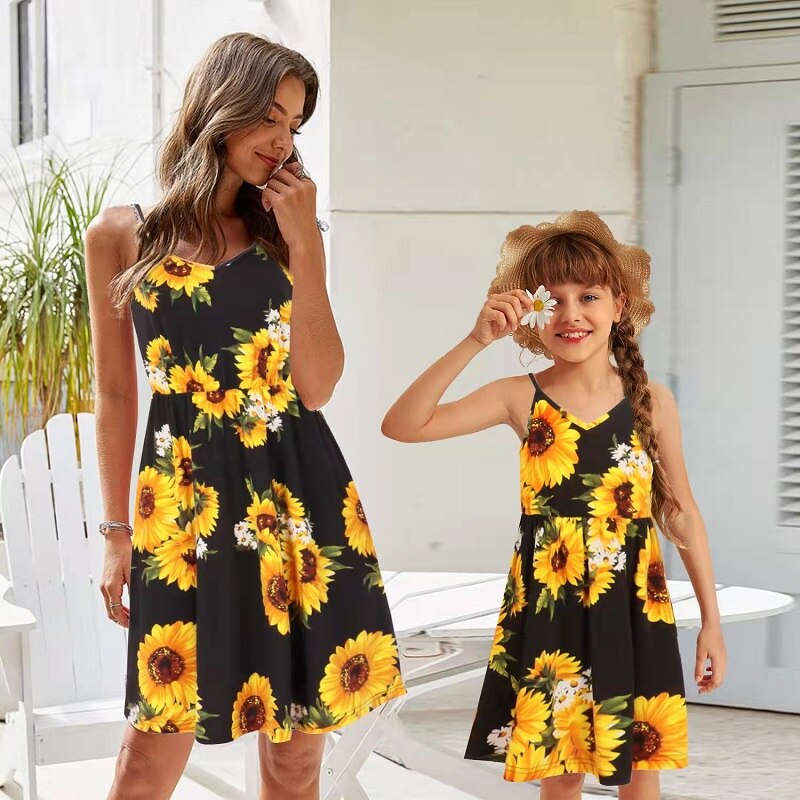Side profile of a girl in a charming sunflower off-shoulder summer dress, girls fashion.
