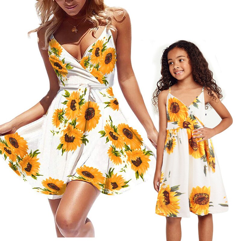 Detail of the off-shoulder design on a women's sunflower casual summer dress.