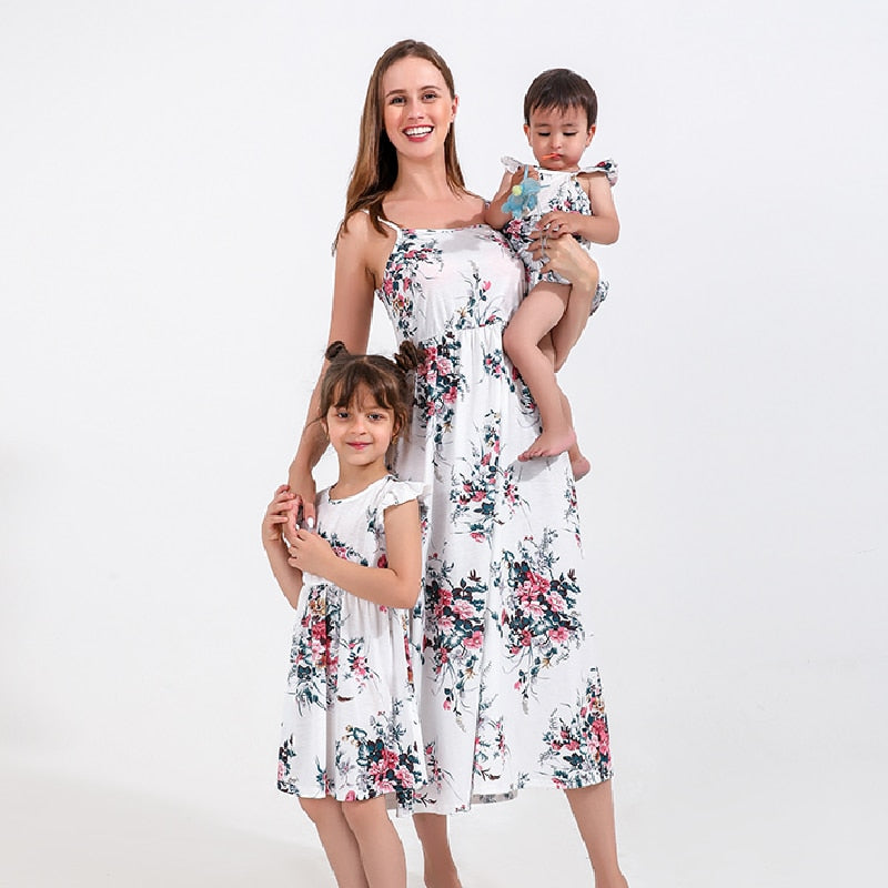 Mom & daughter in matching floral print maxi dresses, perfect for summer family outfits.