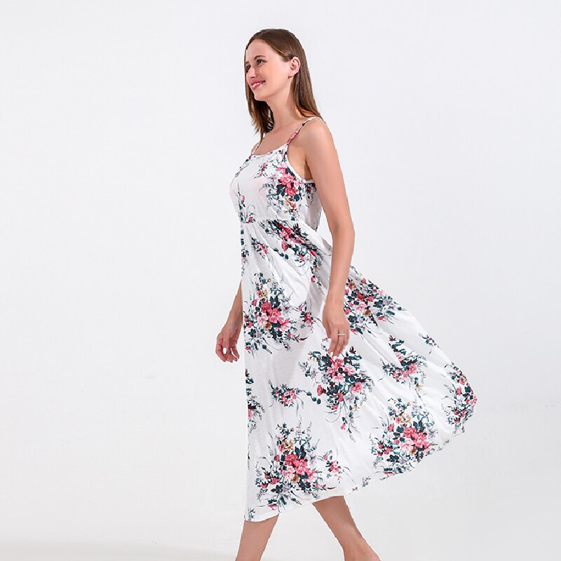 Stylish mom and daughter in vibrant floral print dresses, ideal for spring/summer wear.