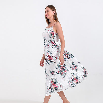 Stylish mom and daughter in vibrant floral print dresses, ideal for spring/summer wear.