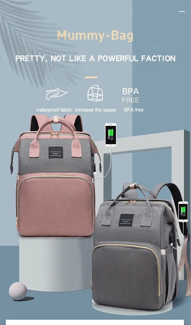 Mom's portable diaper changing bag, waterproof, shown next to a baby stroller