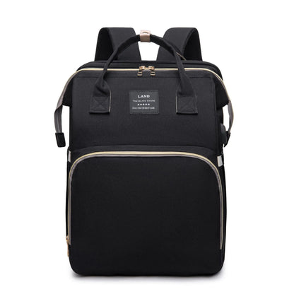 Mom's waterproof diaper backpack, black, with shoulder straps and top handle, travel-ready