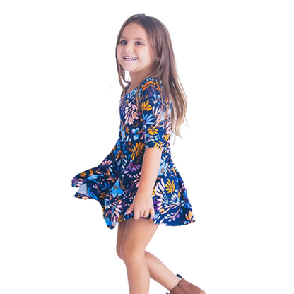 Close-up of blue floral print fabric on mommy and me matching dresses.