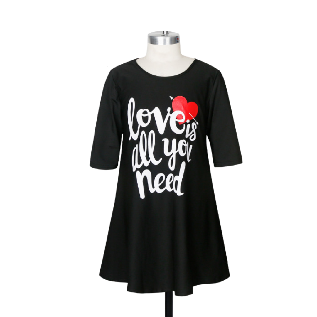 Matching 'Love is All You Need' tee dresses for mom and baby, featuring a comfy cotton blend for casual wear.