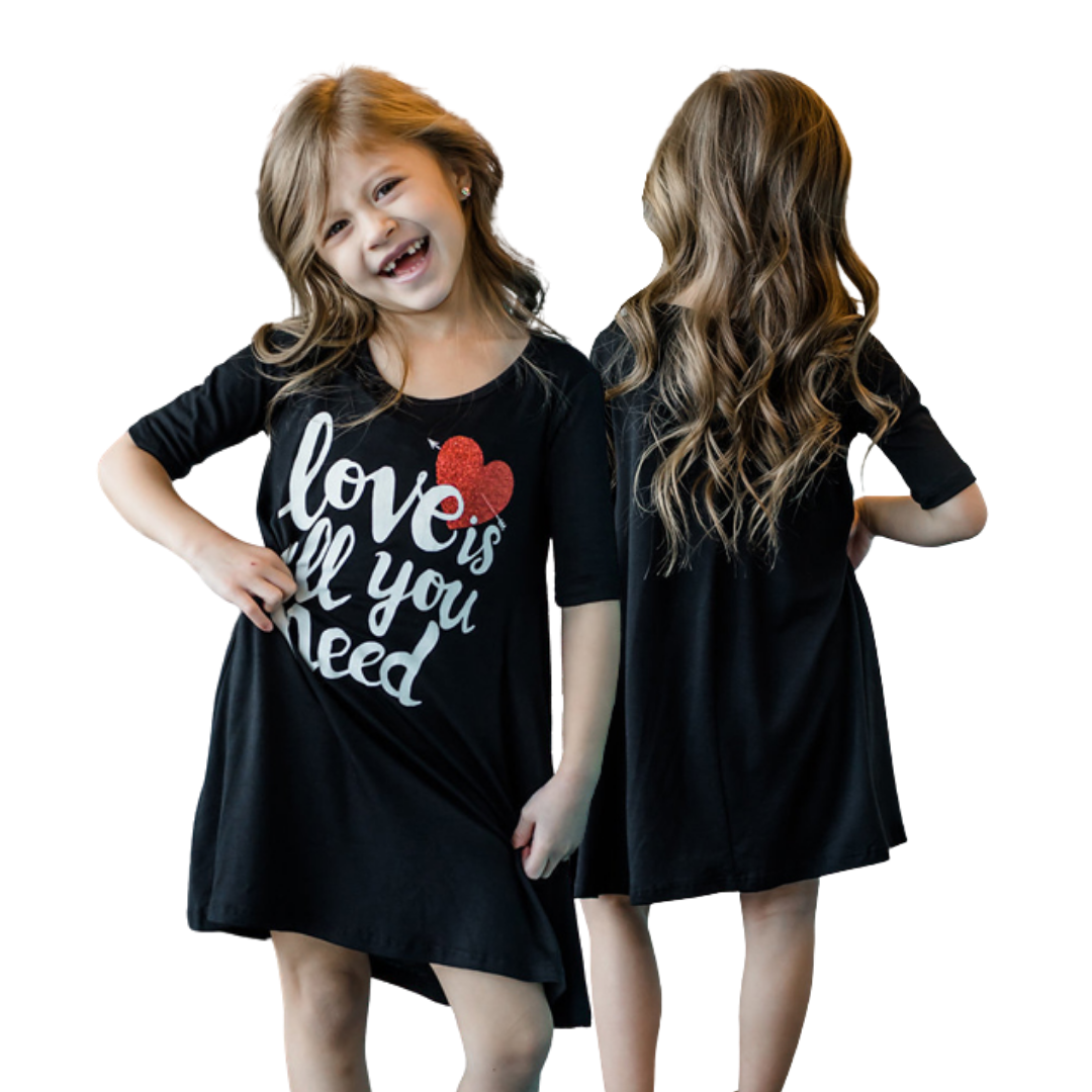 Adorable mother and child wearing 'Love is All You Need' themed summer tee dresses, family clothing collection.