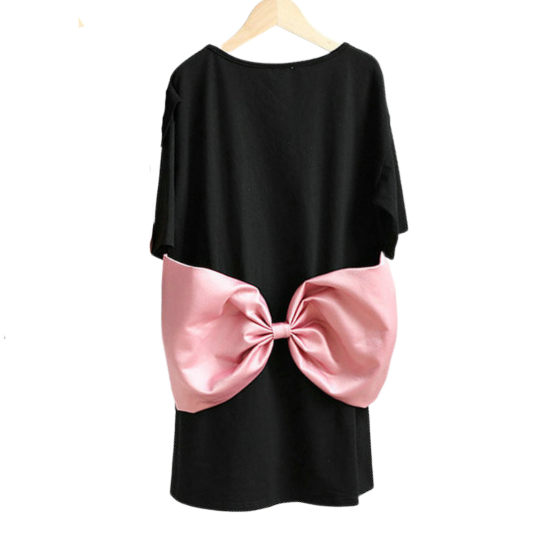 A woman wearing a pink matching tee dress with a big bow, ideal for summer family fashion.