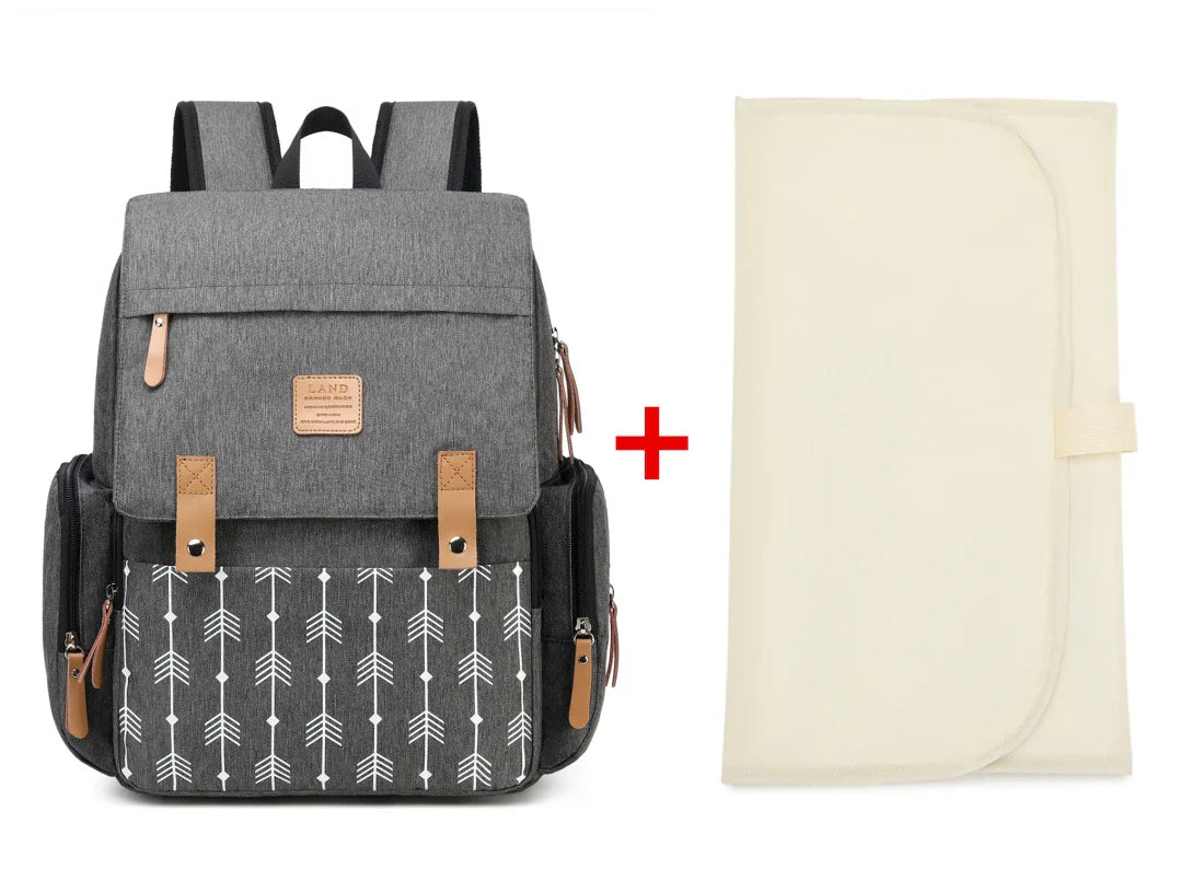 Modern diaper backpack in navy, featuring a comfortable changing mat for infants