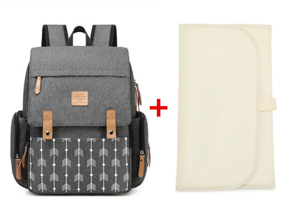 Modern diaper backpack in navy, featuring a comfortable changing mat for infants