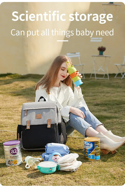 Gender-neutral diaper backpack in olive green, comes with an adaptable changing mat