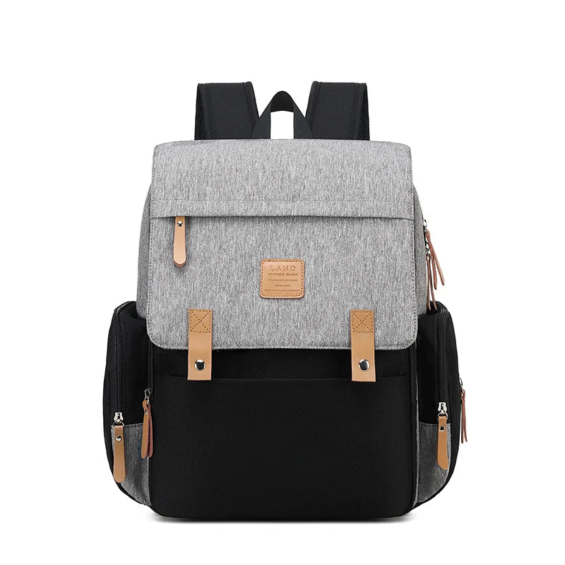 Stylish mommy diaper backpack in gray, includes a waterproof changing mat for baby