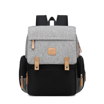 Stylish mommy diaper backpack in gray, includes a waterproof changing mat for baby