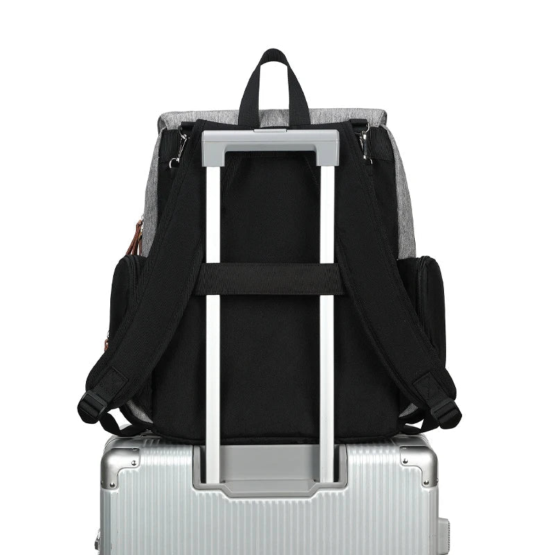 Black mommy diaper backpack with wide opening and included changing pad