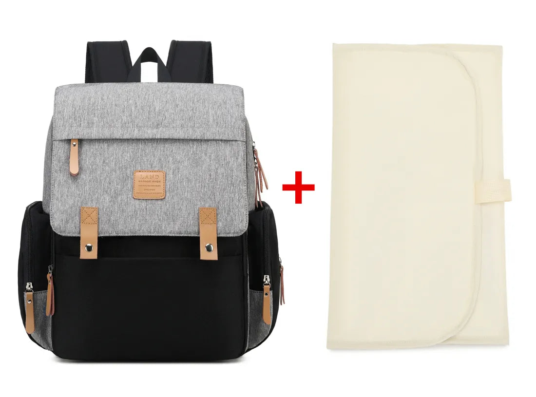 Travel-friendly mommy bag with changing mat, ideal parenting gear for on-the-go