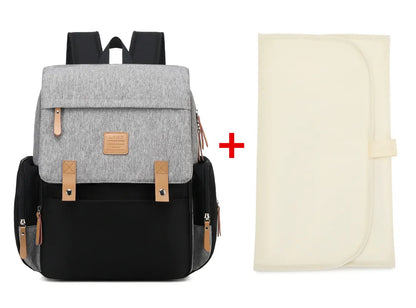 Travel-friendly mommy bag with changing mat, ideal parenting gear for on-the-go