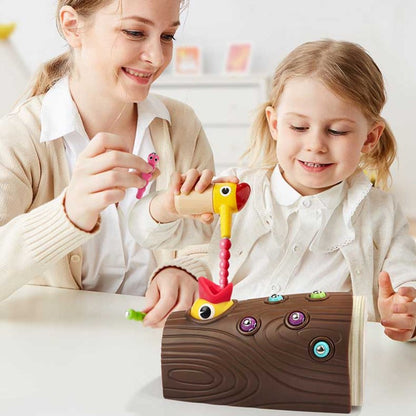 Toddler playing with Montessori Hungry Woodpecker toy, developing fine motor skills and hand-eye coordination