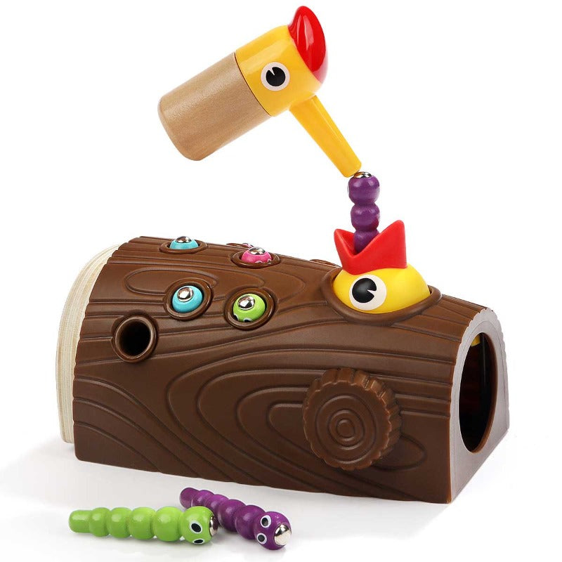 Close-up of Montessori Hungry Woodpecker game. Focus on child's hand guiding woodpecker to pick up a worm