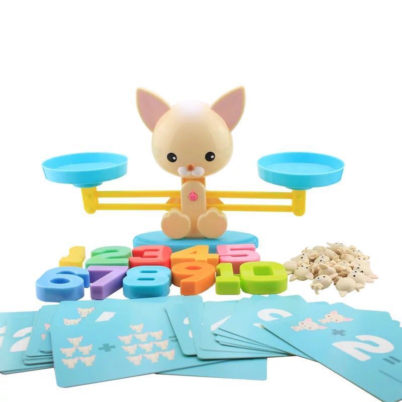 Children playing with a math balance game, learning addition and subtraction