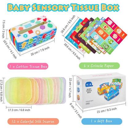 Close-up of baby pulling a vibrant silk scarf from a soft Montessori sensory tissue box toy