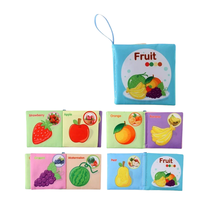 Close-up of a page in a fabric activity book showing fine motor skill development sections for toddlers