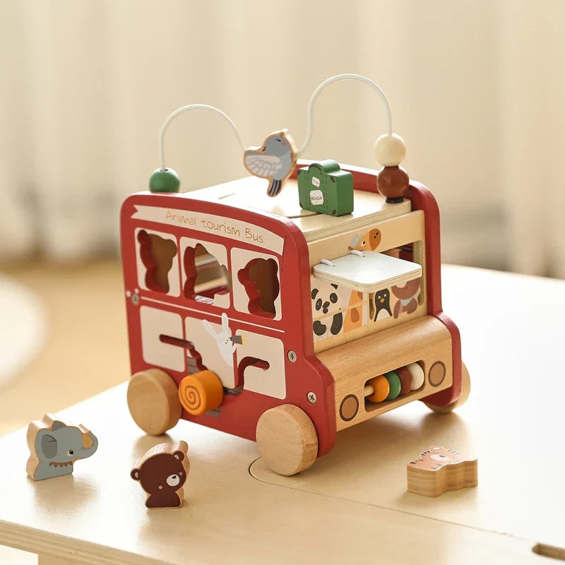 Wooden montessori activity bus for unisex play, fostering problem-solving and fine motor development.