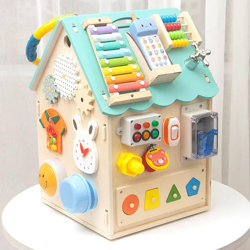 Wooden busy house toy with a clock and abacus, offering educational sensory play for toddlers.