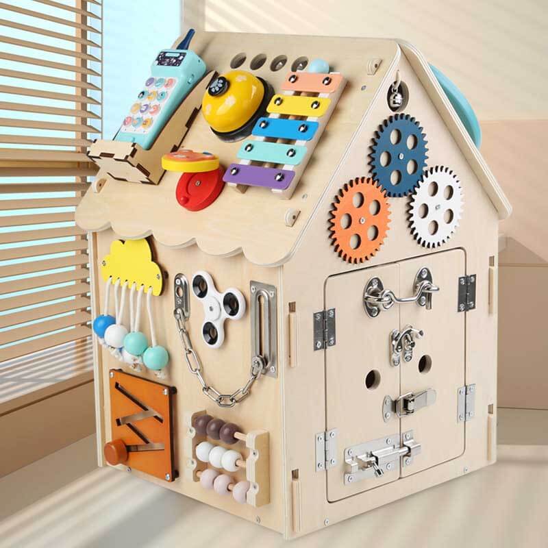Toddler educational wooden busy board house toy, featuring various latches, gears, and sensory elements.