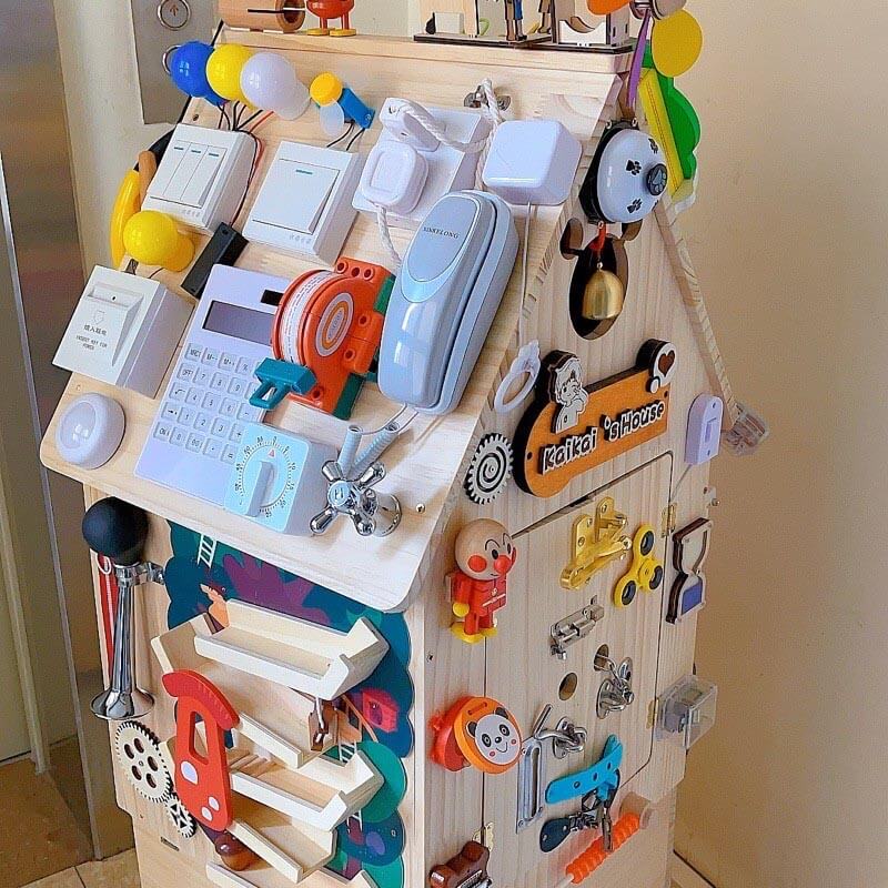Montessori wooden busy house, a versatile educational toy for developing fine motor and cognitive skills.