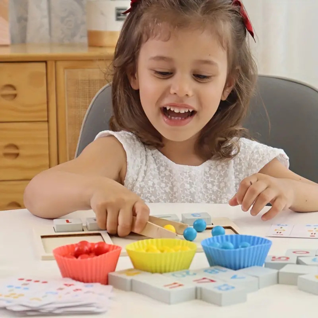 Close-up of a Montessori counting educational game, showing hands sorting colorful rings onto numbered pegs.