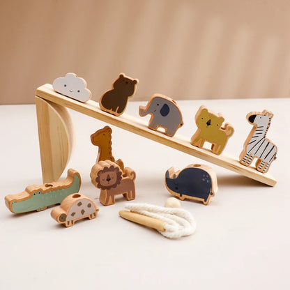 Montessori wooden seesaw with colorful animal blocks, developing fine motor skills in toddlers