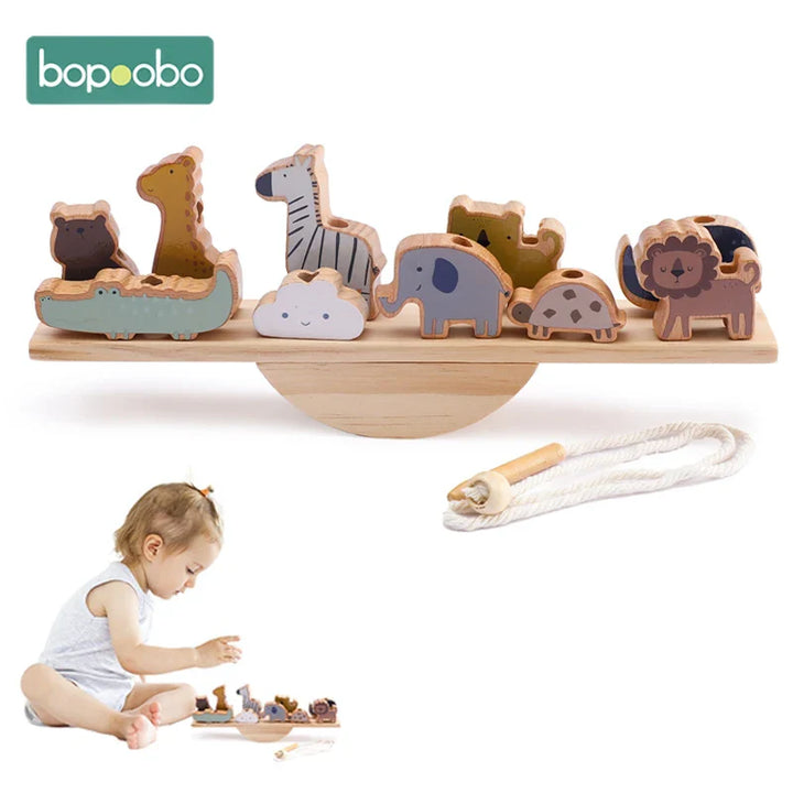 Wooden balancing toy featuring cute animal shapes for threading and stacking, ideal for early learning