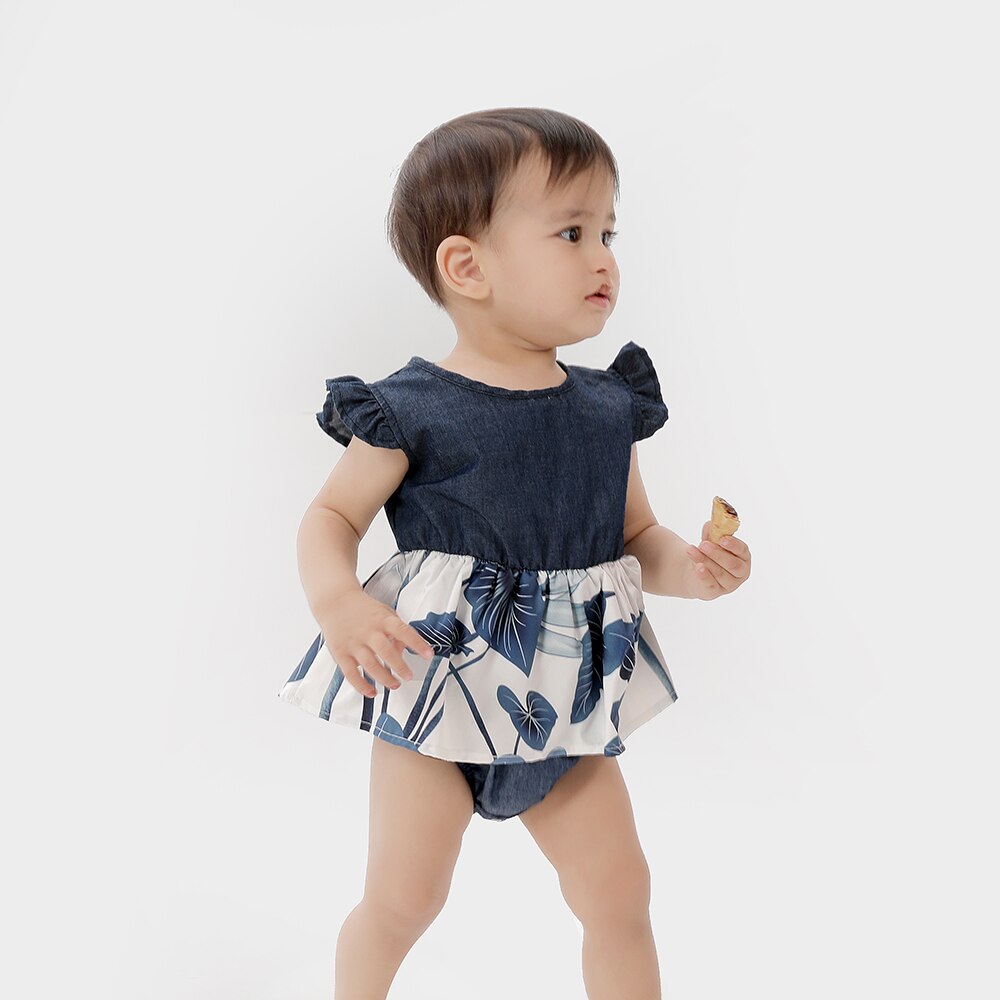 Sweet baby girl in a floral ruffle sleeve dress, matching her mom's outfit, showcasing girls fashion